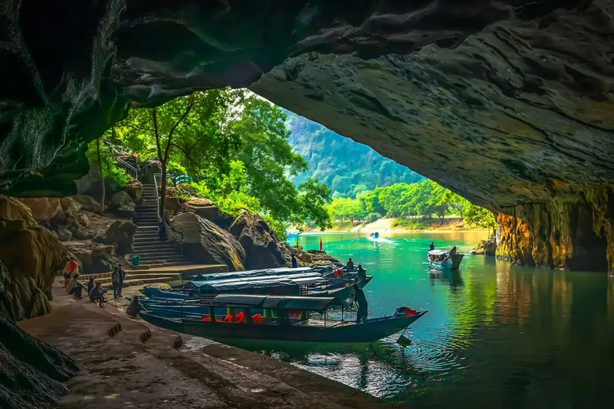 Boat travelling through the flooded interior of Phong Nha Cave on the Son River