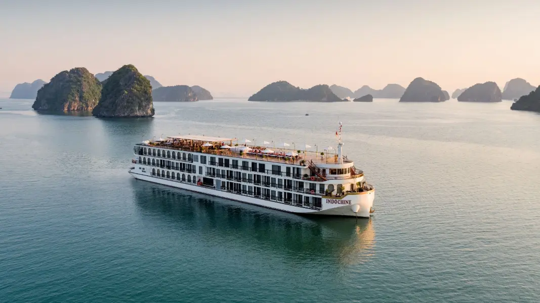 Indochine Grand Cruise — a premium wooden junk sailing the karst waters of Lan Ha Bay