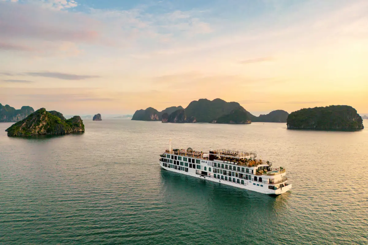 Luxury cruise ship in Halong Bay with limestone karsts